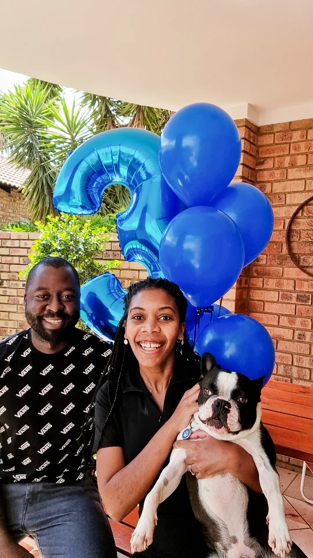 The whole crew. Joel, Charlie, and too many balloons.