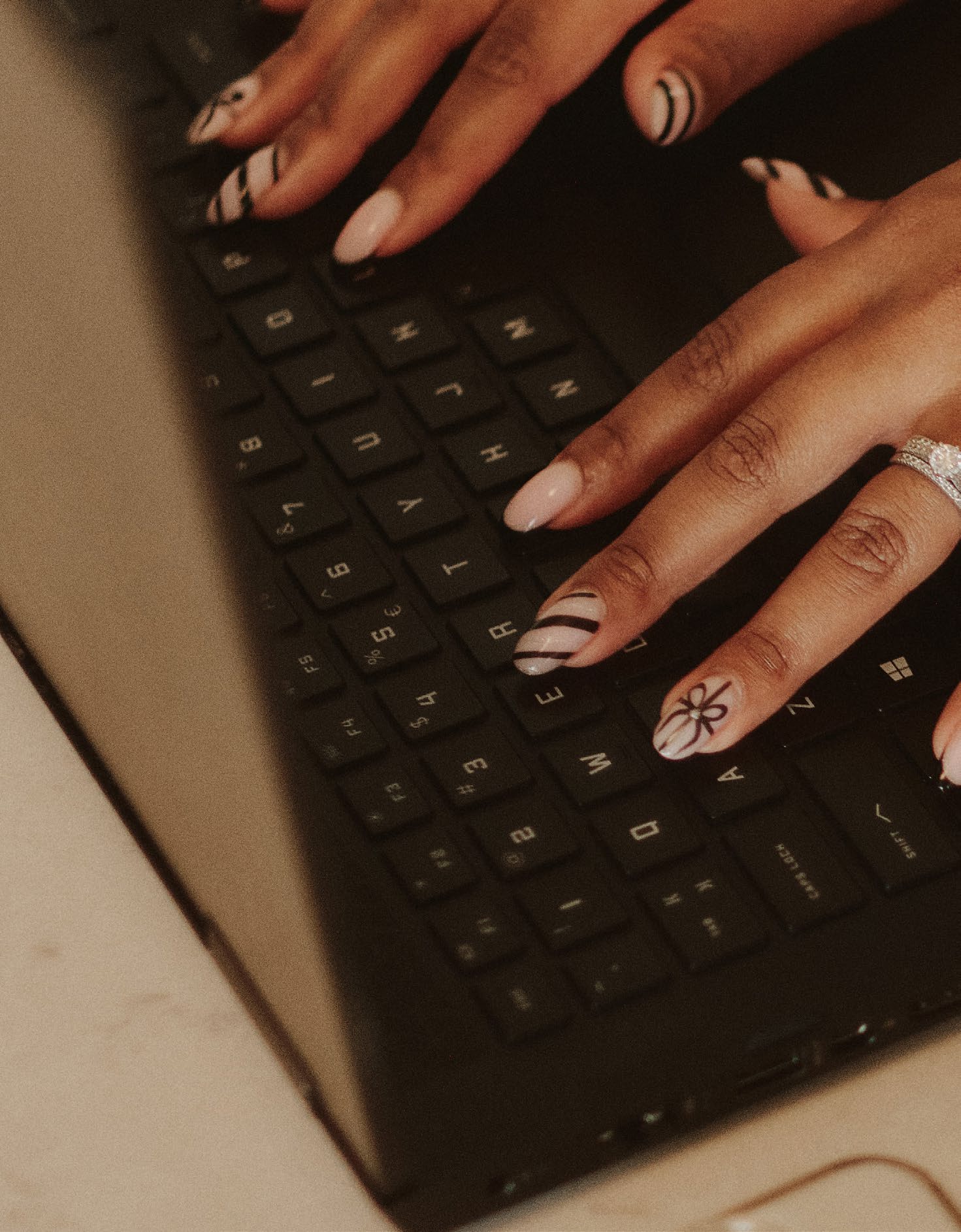 Carol Kabaale working at her laptop